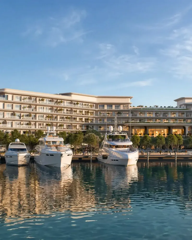 The Bristol seen from Ramhan Marina, with yachts moored below the residences, developer render