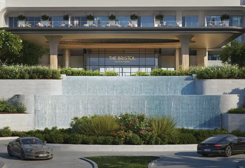 The arrival court of The Bristol, with its cascading water wall, developer render